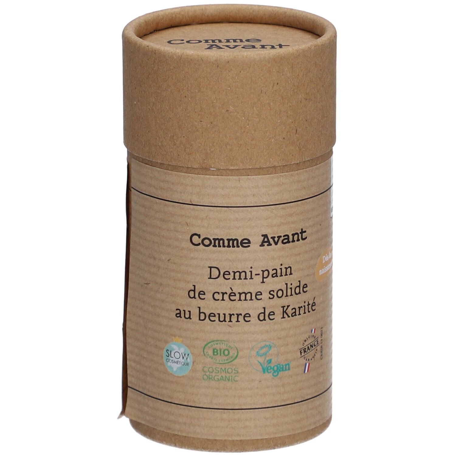 Emballage cylindrique en carton. Inscription: Comme Avant, Demi-pain de crème solide au beurre de Karité. Logos bio et vegan.