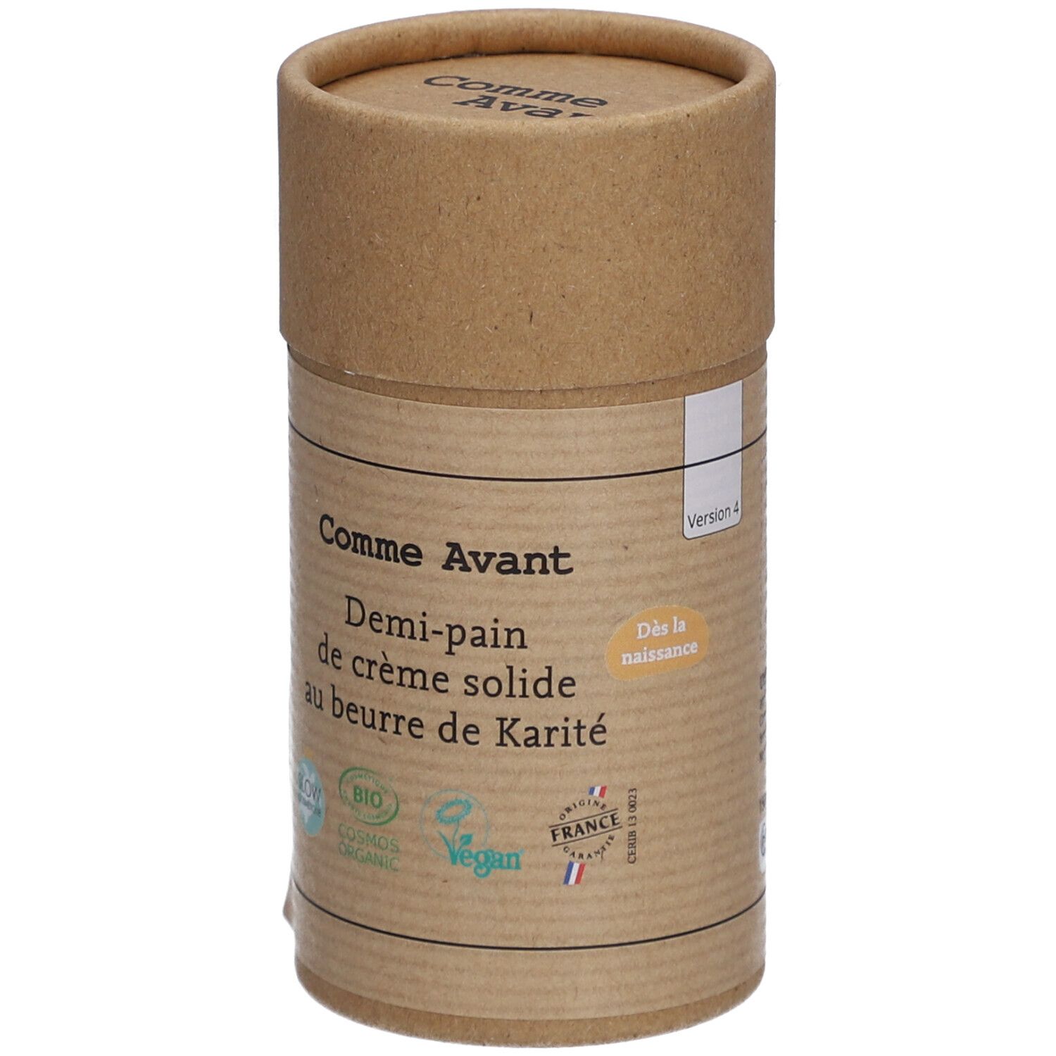 Emballage cylindrique en carton. Inscription: Comme Avant, Demi-pain de crème solide au beurre de Karité. Logos bio et vegan.
