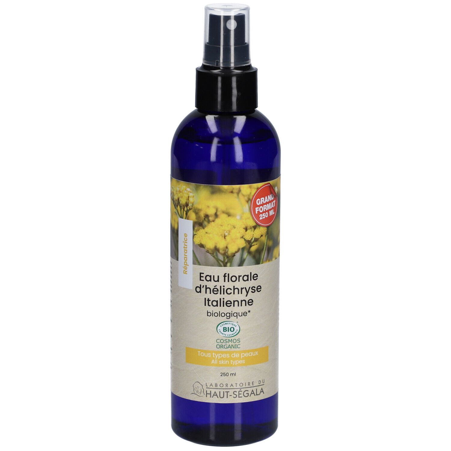 Flacon bleu avec vaporisateur. Étiquette avec texte : Eau florale d'h

lélichryse Italienne biologique. Certification bio. Grand format.