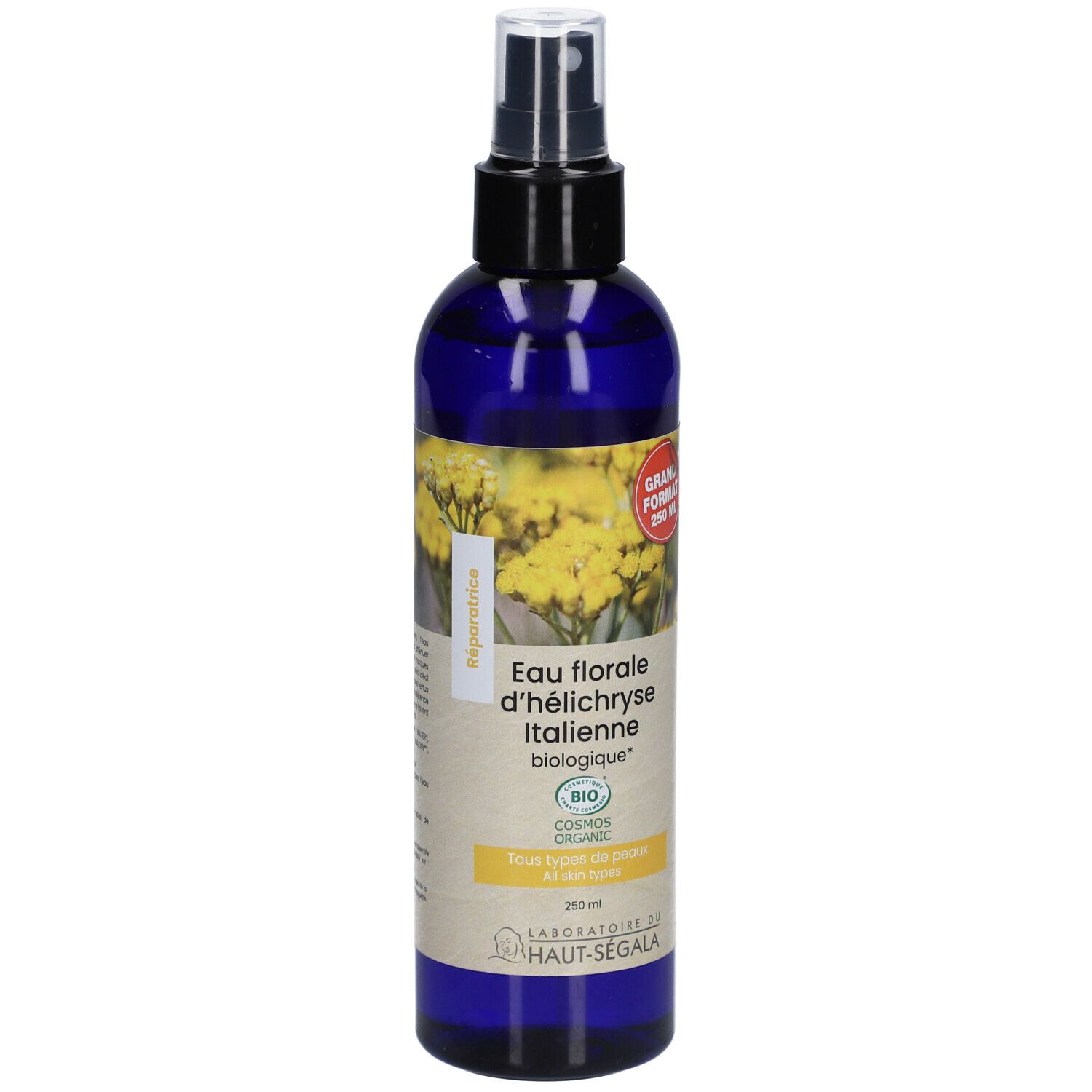 Flacon bleu avec vaporisateur. Étiquette avec texte : Eau florale d'h

lélichryse Italienne biologique. Certification bio. Grand format.