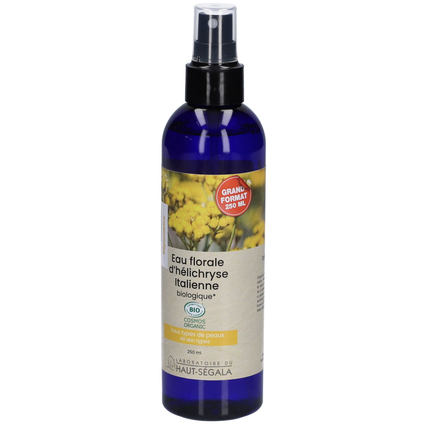 Flacon bleu avec vaporisateur. Étiquette avec texte : Eau florale d'h

lélichryse Italienne biologique. Certification bio. Grand format.