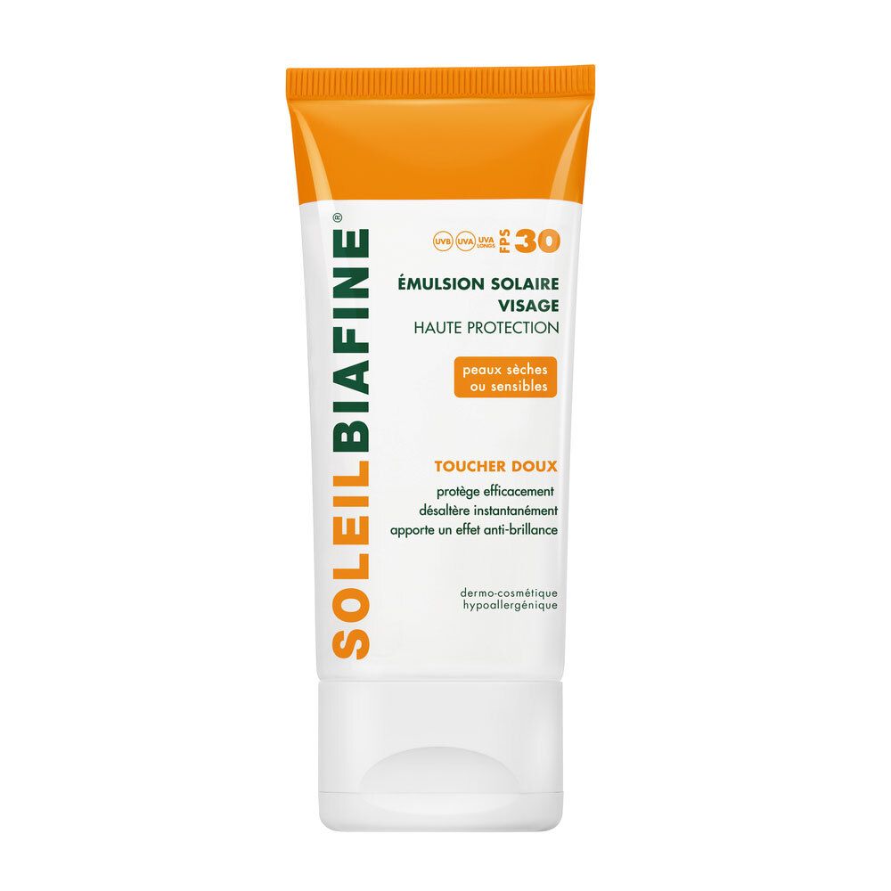 Émulsion solaire visage. Tube blanc et orange. Texte: SoleilBiafine, SPF30, Haute Protection, peaux sèches ou sensibles.