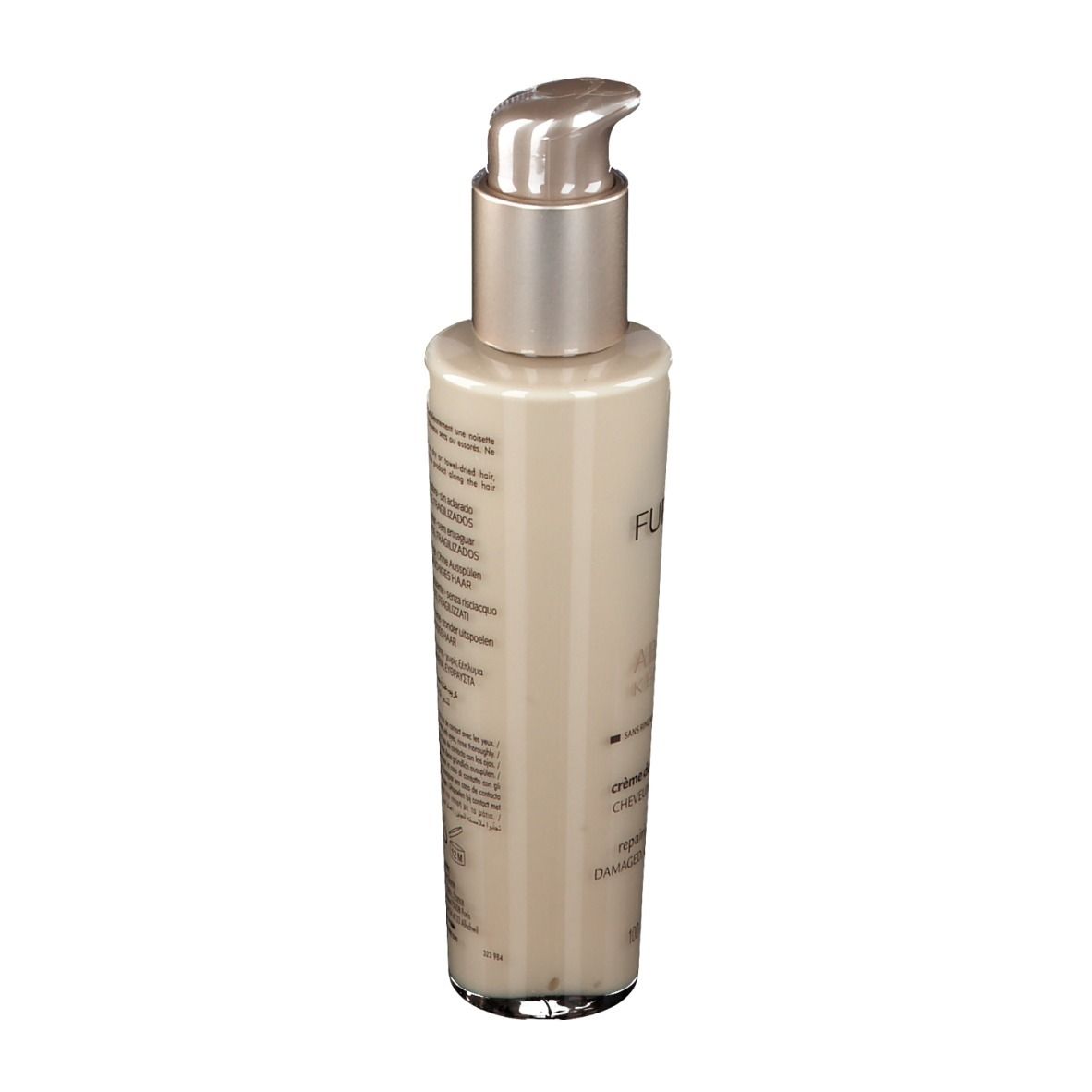 Flacon beige avec pompe argentée. Texte au dos. Produit pour cheveux abîmés.