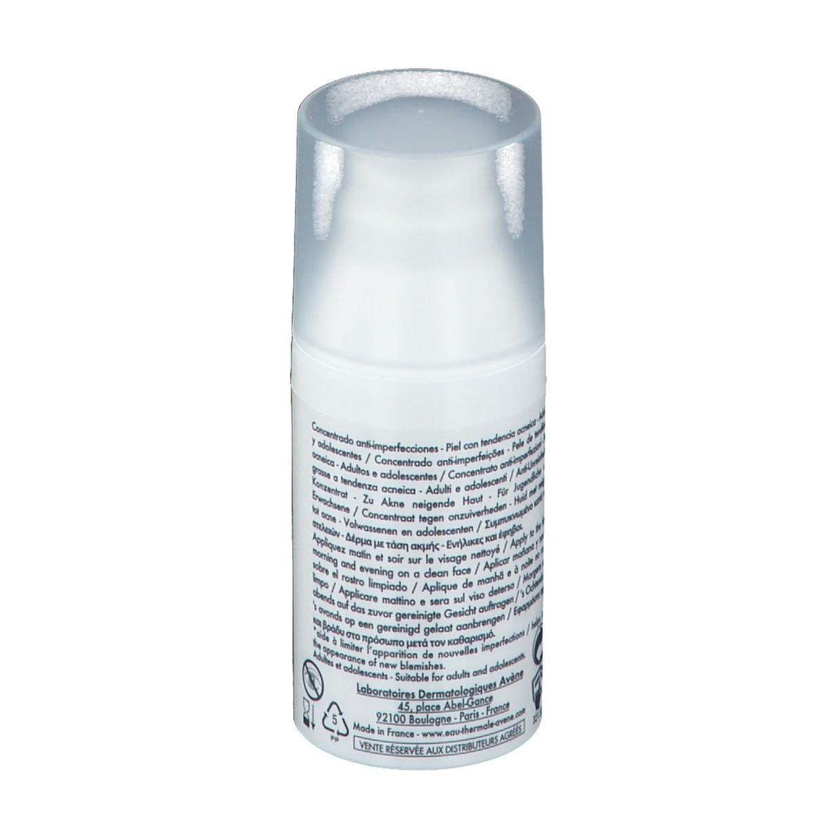 Flacon blanc avec pompe. Texte sur le côté. Nom du produit non visible. Avec avertissements et symboles de recyclage.