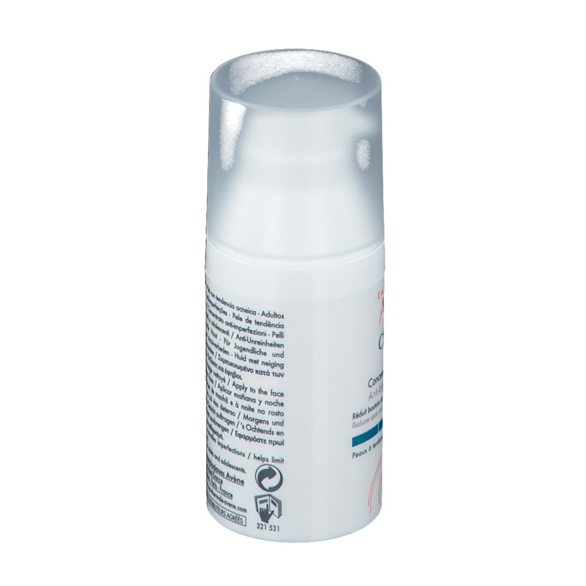 Flacon blanc avec pompe. Texte sur le côté. Nom du produit non visible. Avec avertissements et symboles de recyclage.