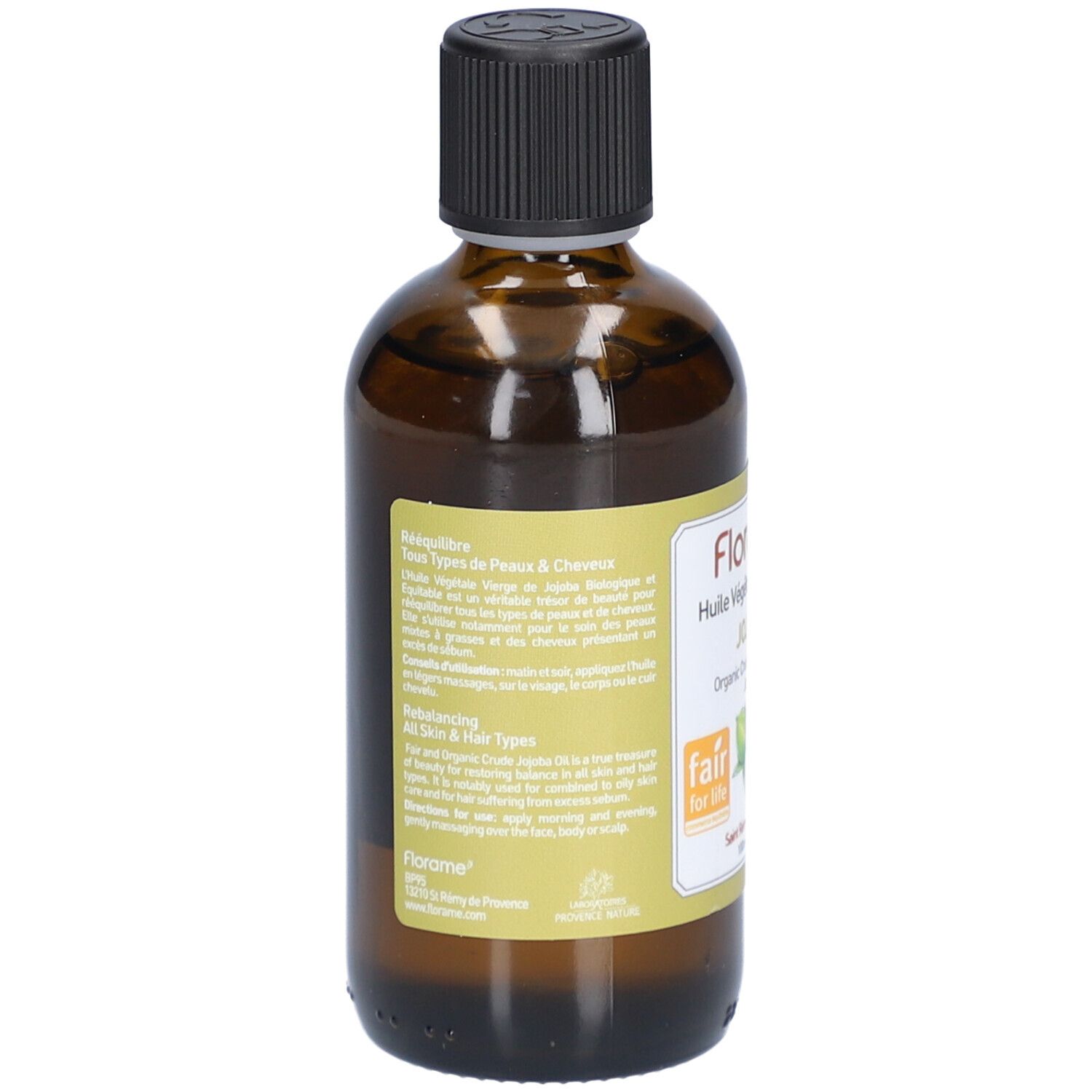 Rückseite einer braunen Glasflasche mit schwarzem Deckel. Etikett mit Text und Logos. Fair for Life-Siegel und Bio-Zertifizierung.