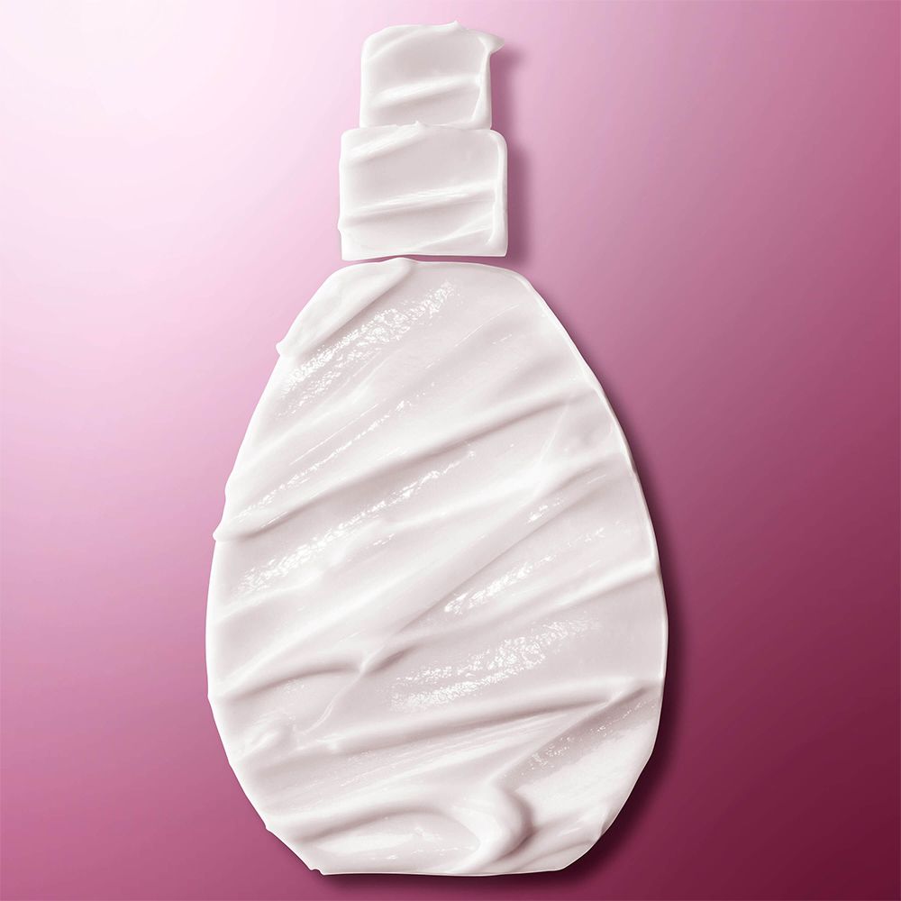Umriss einer Flasche mit Creme bedeckt. Rosa Hintergrund.