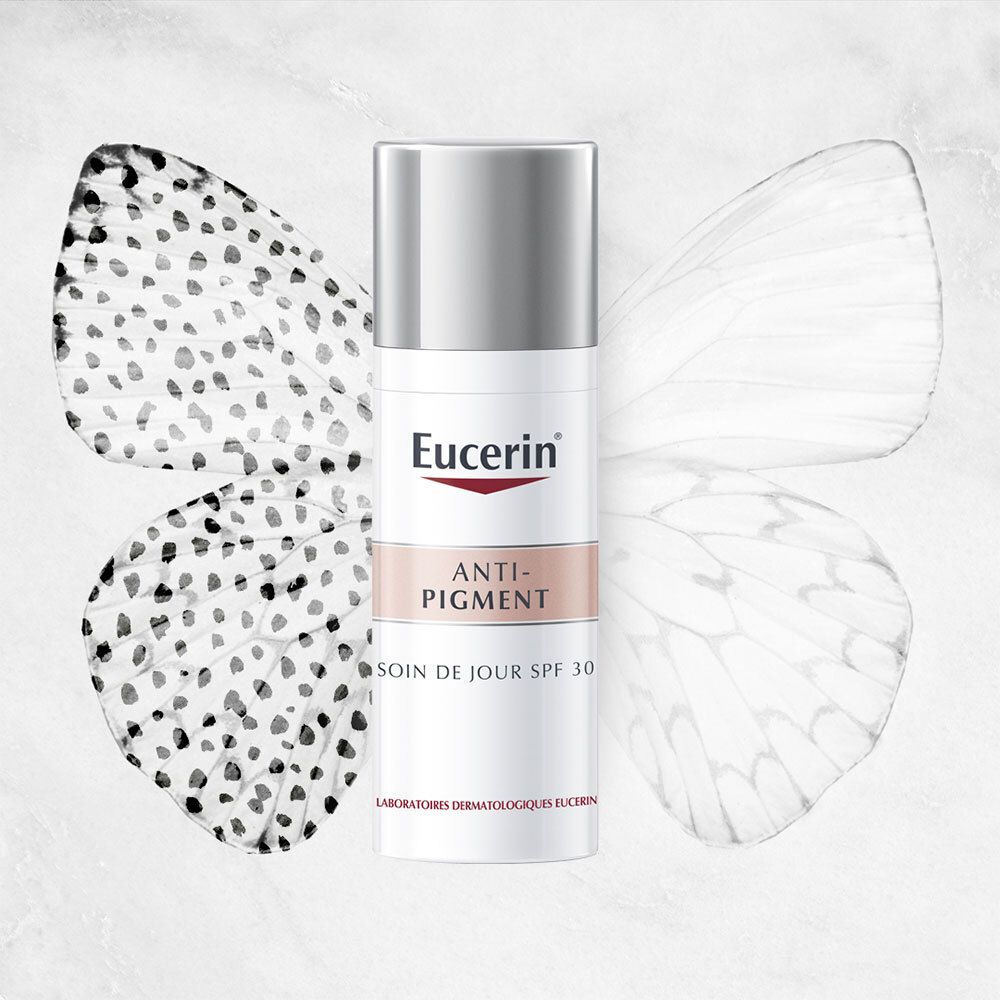 Eucerin Anti-Pigment Tagespflege LSF 30. Weiße Flasche mit silbernem Deckel. Schmetterlingsflügel im Hintergrund.