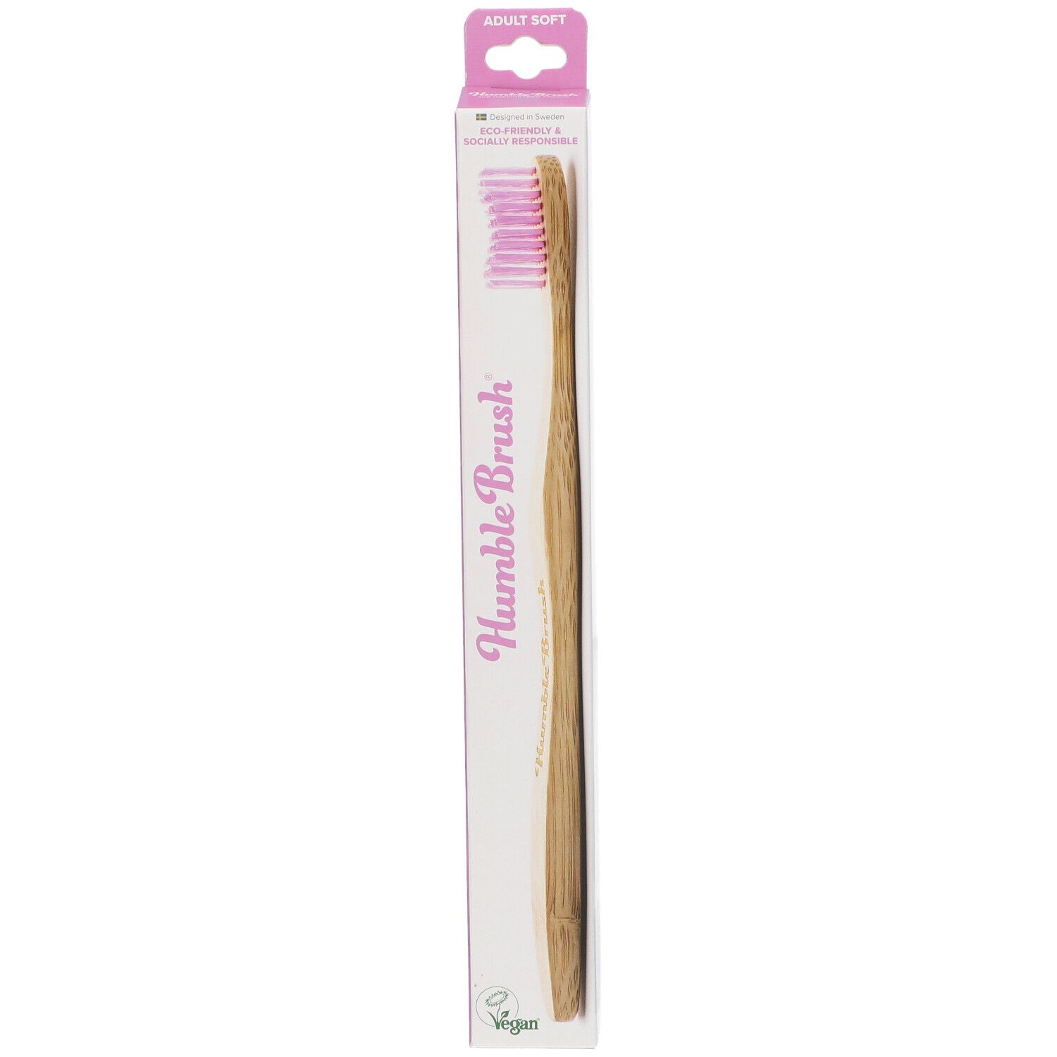 Brosse à dents rose et manche en bambou dans son emballage. Inscription : Humble Brush.