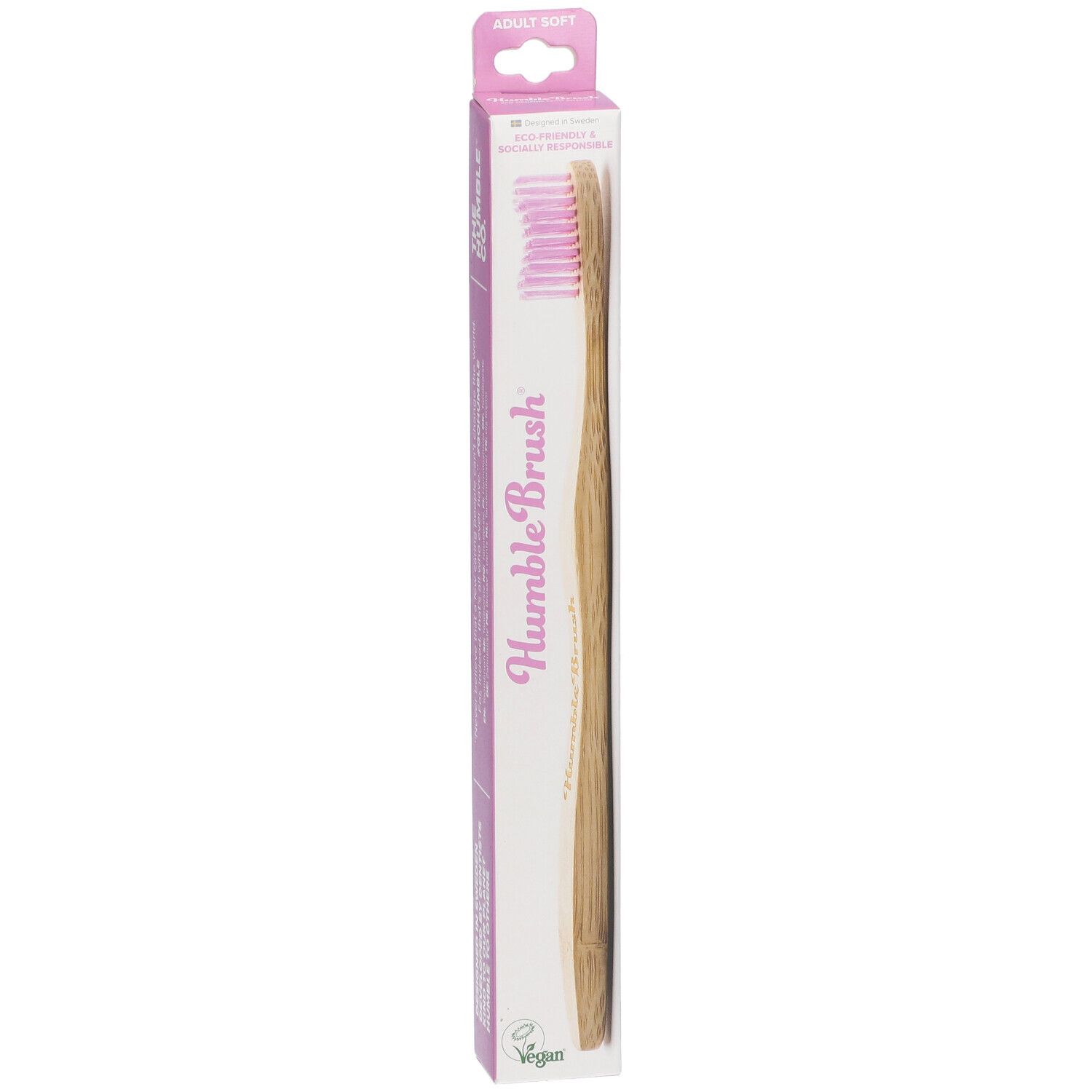 Brosse à dents rose et manche en bambou dans son emballage. Inscription : Humble Brush.