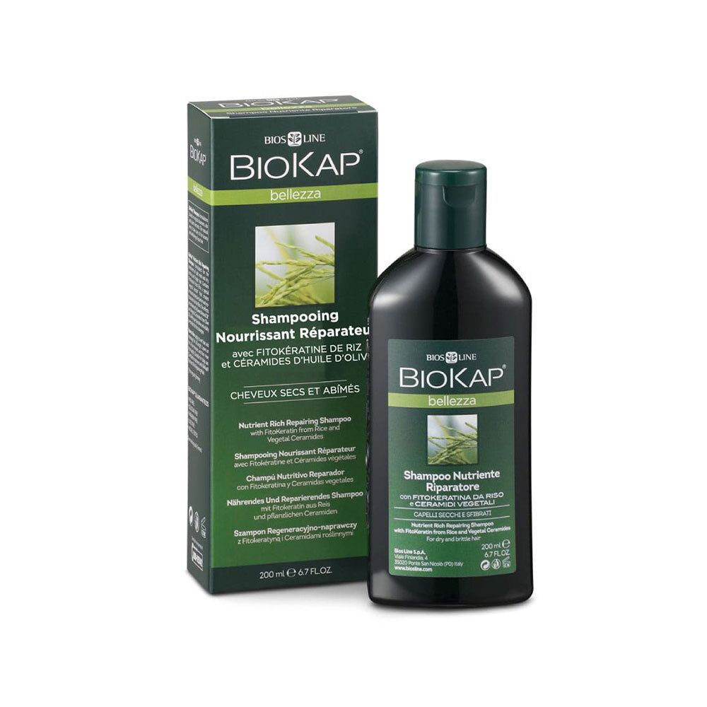 Flacon et boîte de shampooing verts. Inscription BIOKAP, Shampooing Nourrissant Réparateur. Pour cheveux secs et abîmés.