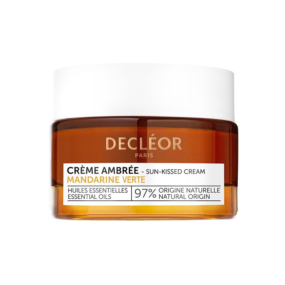 Crème ambrée dans un pot en verre avec couvercle blanc. Inscription : DECLÉOR, Crème Ambrée, Mandarine Verte, 97% origine naturelle.