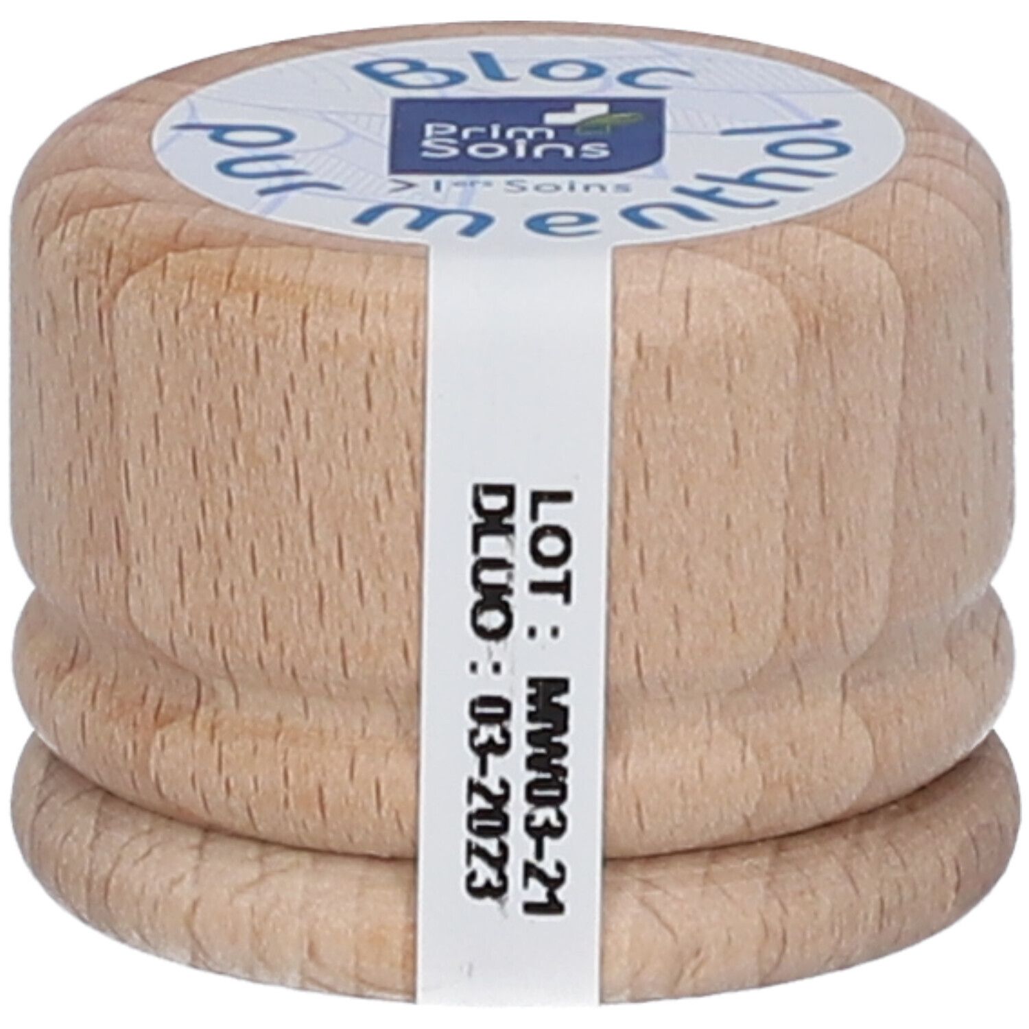 Bloc cylindrique en bois avec étiquette. Inscription : Bloc pur menthol. Étiquette avec date de péremption.