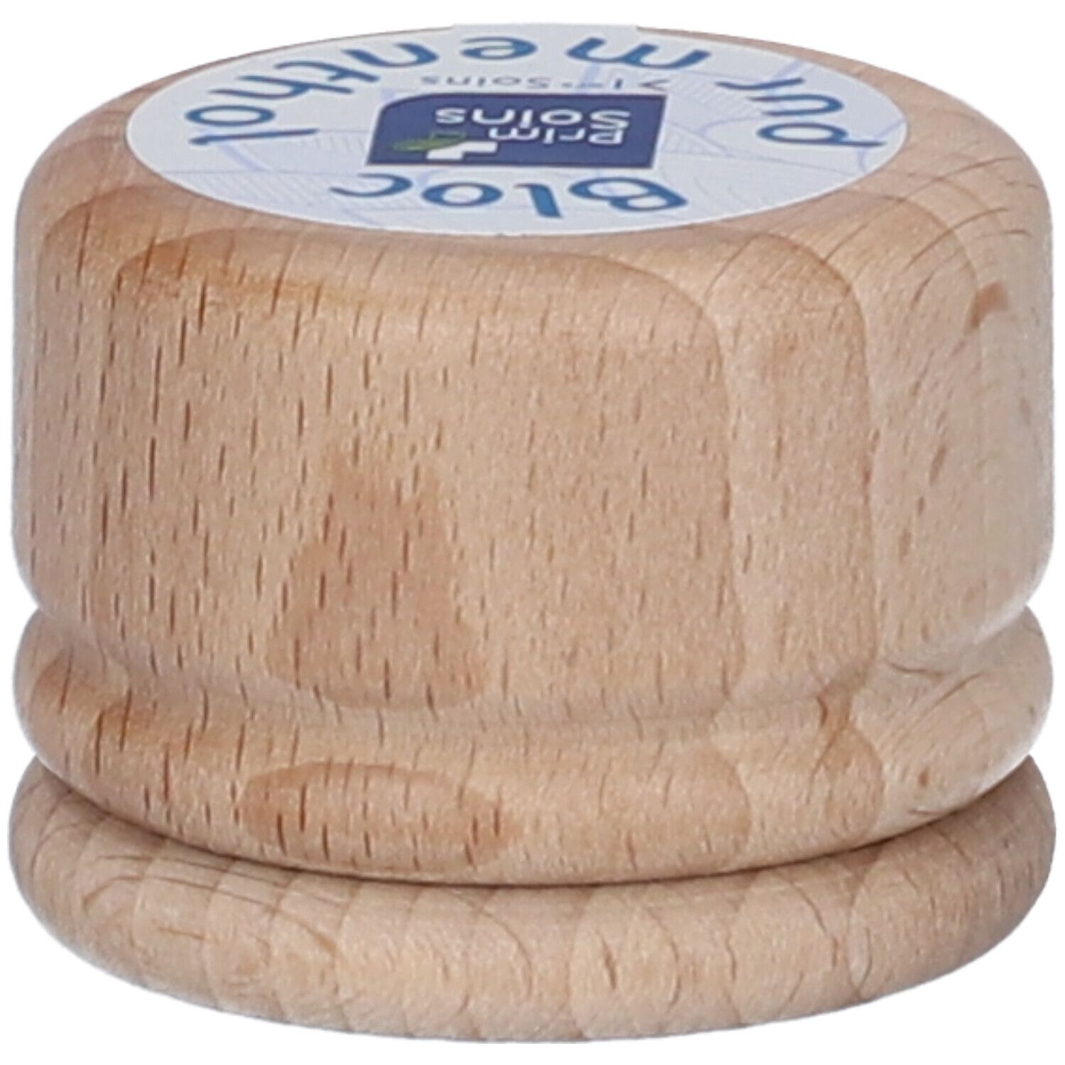 Bloc cylindrique en bois avec étiquette. Inscription : Bloc pur menthol. Vue du produit de dessus.
