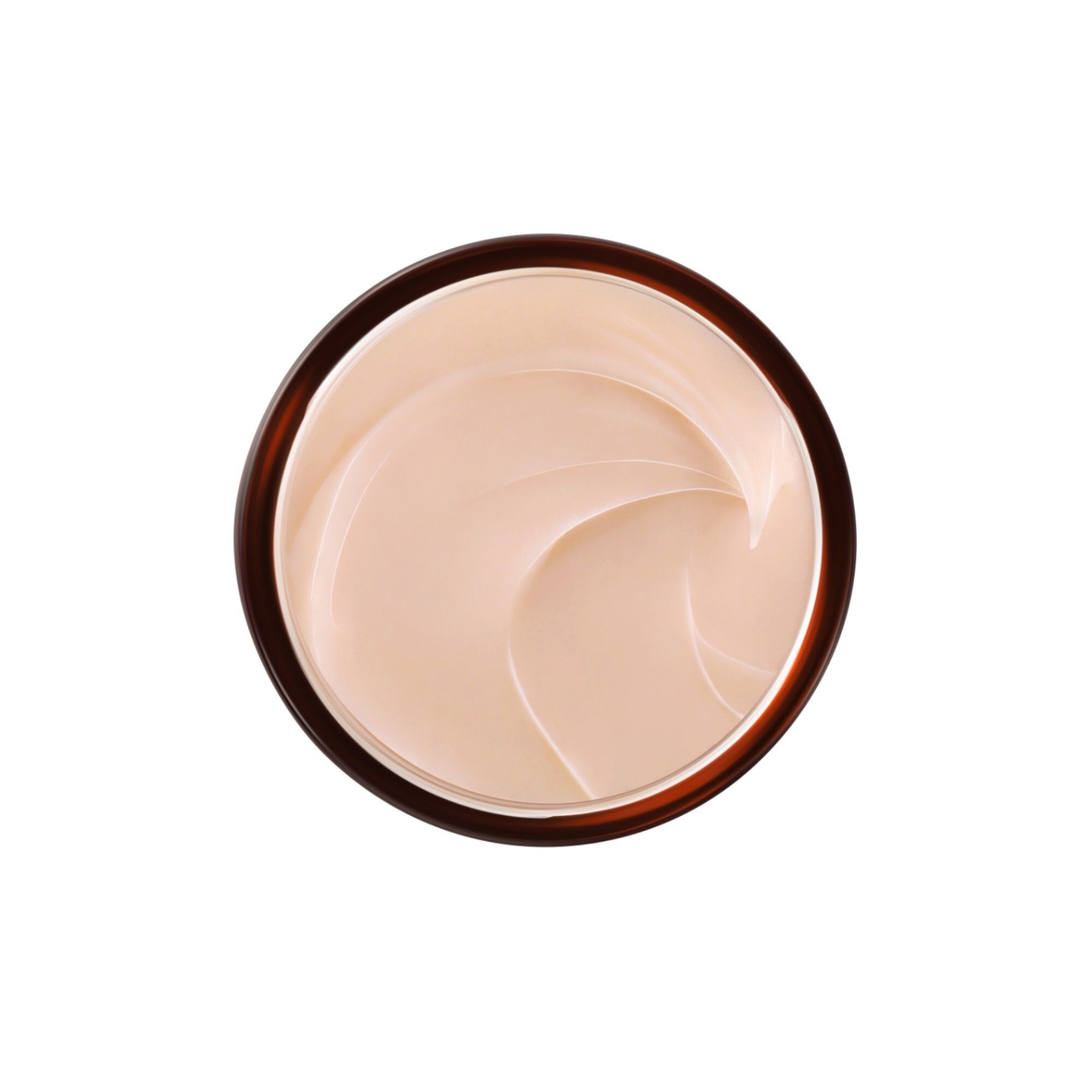 Draufsicht auf eine Creme. Die Creme ist hellbraun und hat eine glatte, gewellte Textur.