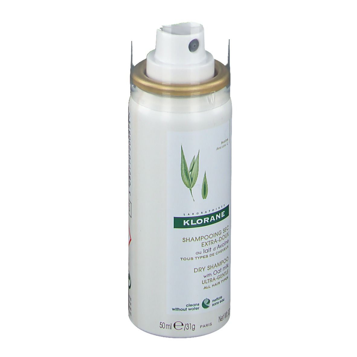 Shampooing sec Klorane à l'avoine. Flacon blanc avec tête de pulvérisation. Nom du produit, logo et feuilles vertes.