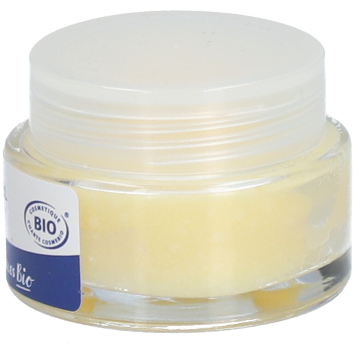 Pot en verre avec couvercle blanc. Crème jaune visible. Certification Bio.