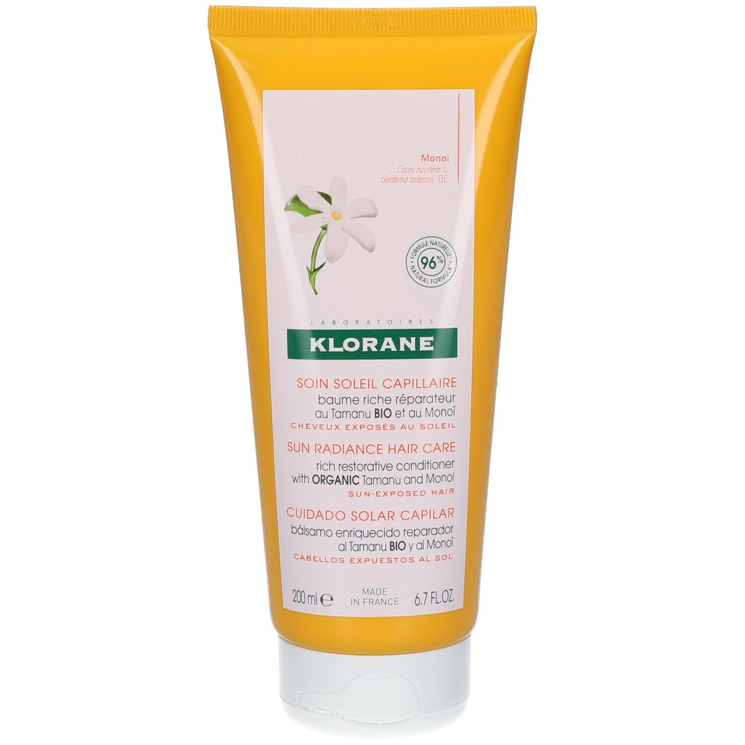 Tube jaune avec textes et logo. Inscription : KLORANE, SOIN SOLEIL CAPILLAIRE. Motif floral et label de qualité.