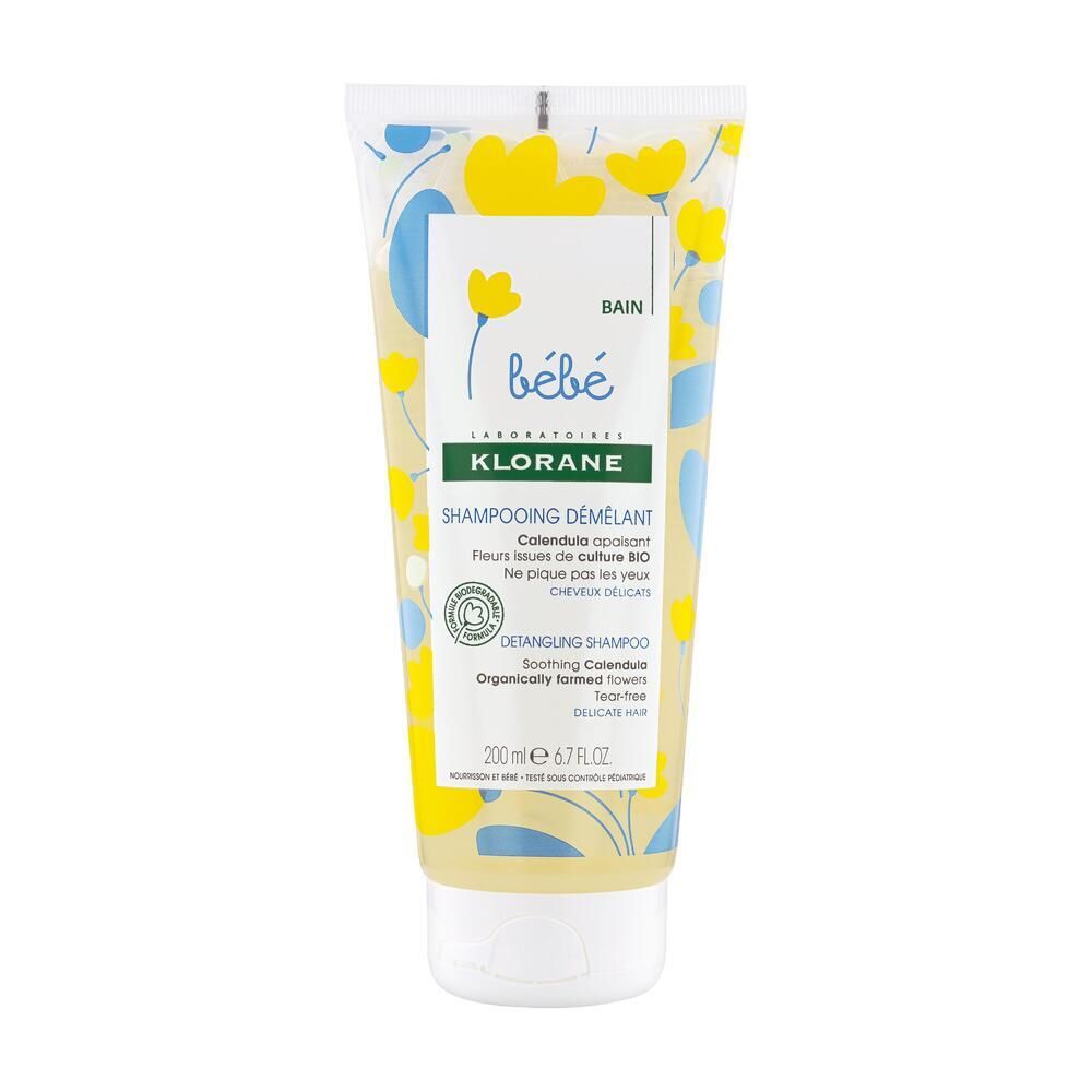 Gelbe Tube mit floralem Muster. Aufschrift: Klorane Bébé, Shampooing démêlant, 200ml. Bio-Qualität.