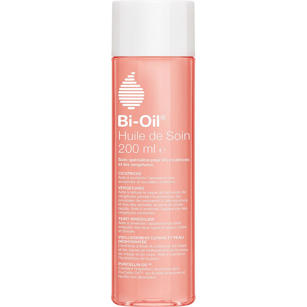 Flacon Bi-Oil®. Liquide rose, bouchon blanc. Texte.