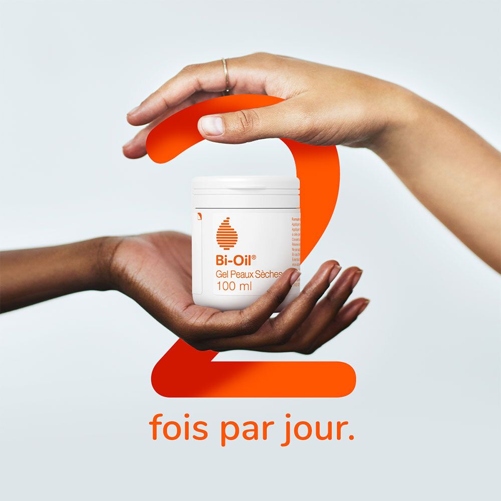 Zwei Hände halten einen weißen Tiegel. Orangefarbene Zahl 2 und Text: fois par jour.