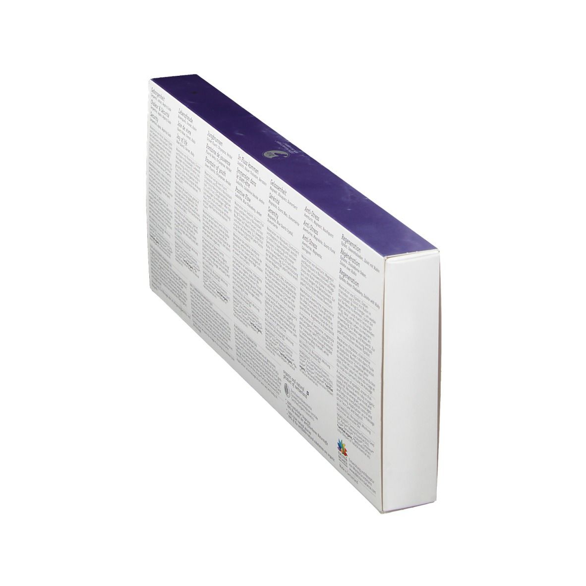 Dos du coffret, vue oblique. Textes multilingues. Informations sur les huiles de pierres précieuses. Fond blanc, couvercle violet.