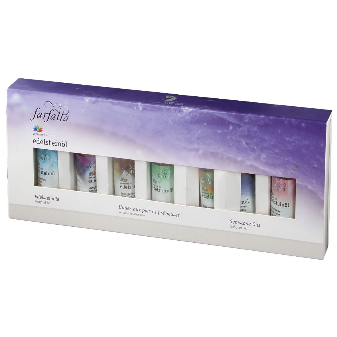 Coffret de bien-être farfalla Edelsteinöle. Six petits flacons dans une boîte blanche avec fenêtre. Inscriptions en allemand, français et anglais.