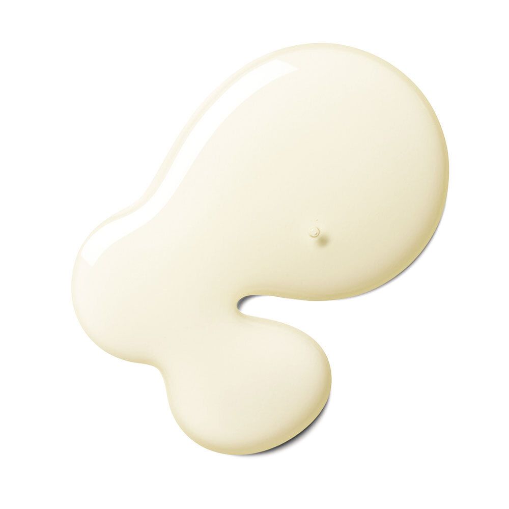 Goutte de liquide jaunâtre sur fond blanc.