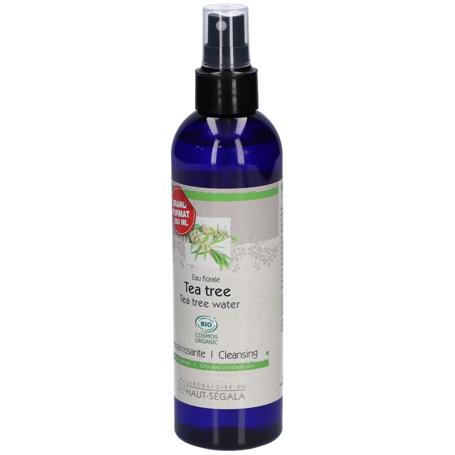 Blaue Flasche mit Sprühkopf. Etikett mit Text: Eau florale de tea tree. Bio-Zertifizierung. Großes Format.