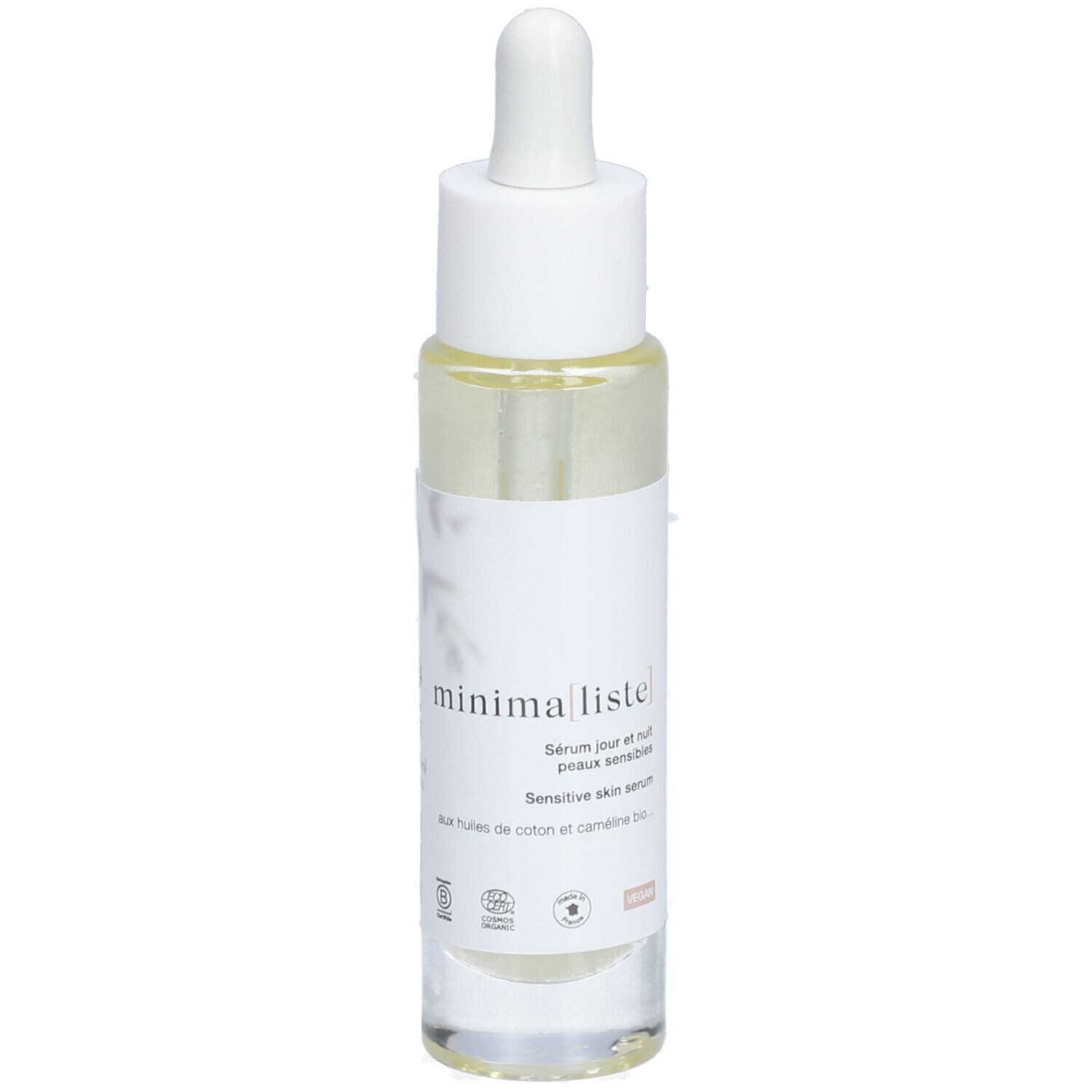 Sérum clair en flacon de verre avec pipette. Inscription : minimaliste. Pour peaux sensibles.