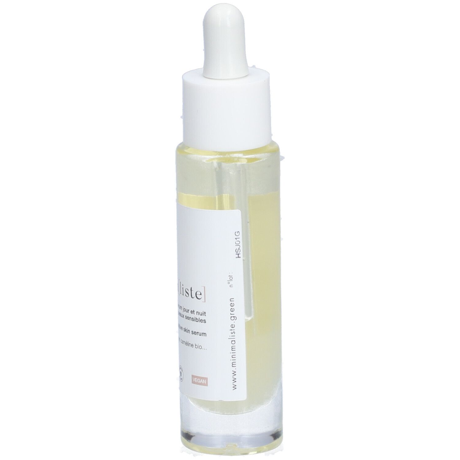 Sérum clair en flacon de verre avec pipette. Inscription : minimaliste. Pour peaux sensibles.