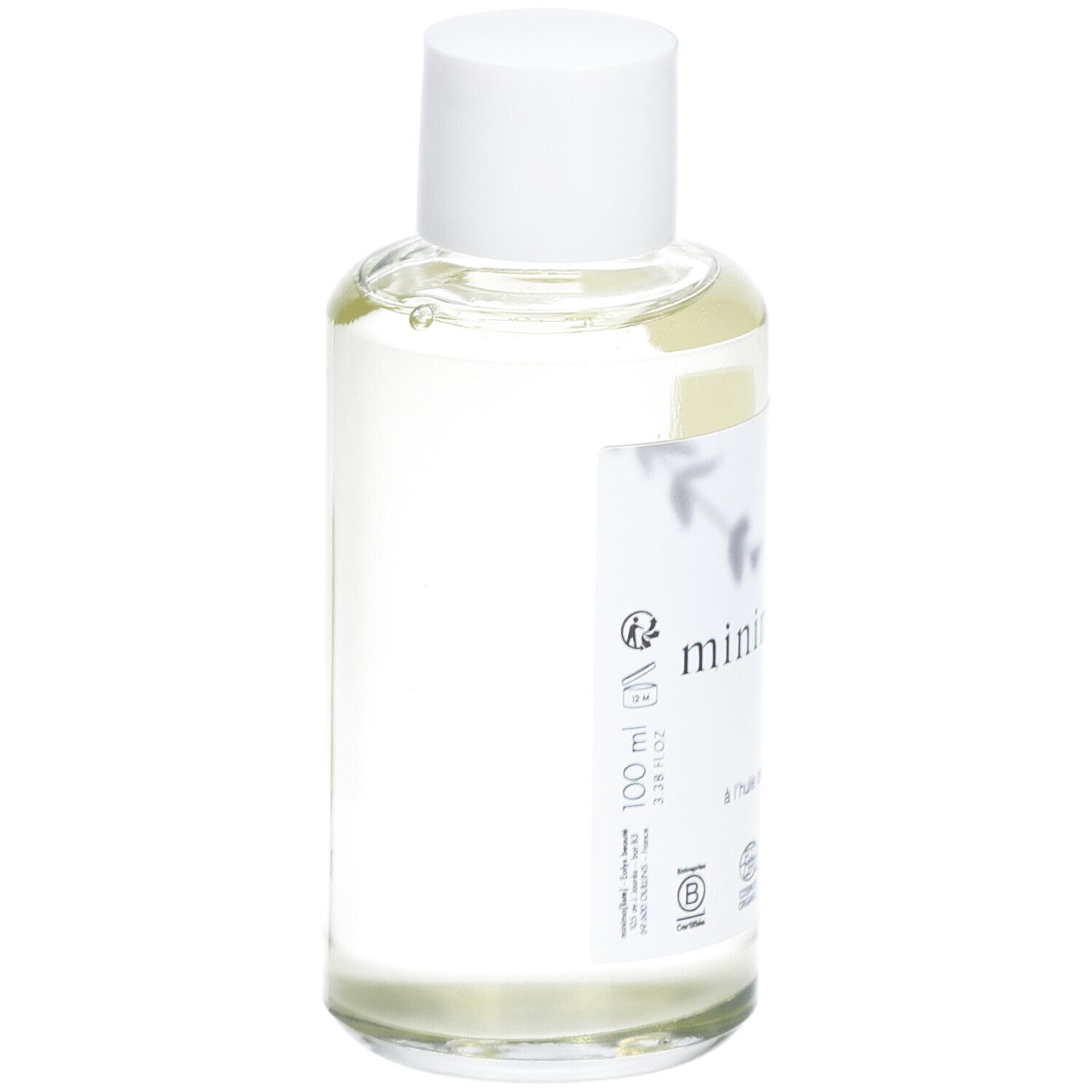 Flacon en verre transparent avec bouchon blanc et étiquette. Inscription : minima[liste]. Face cleansing oil. Vegan. Cosmos Organic.