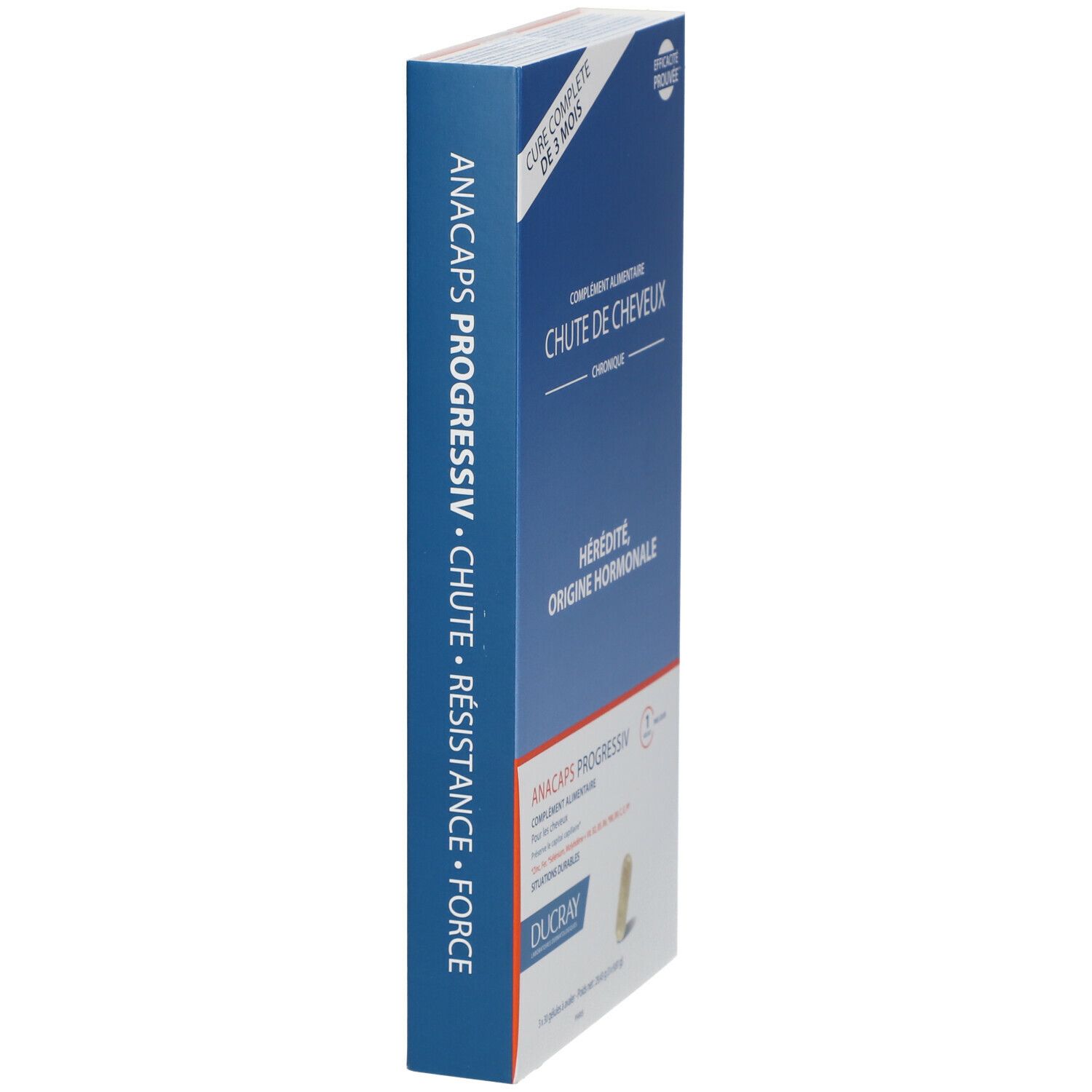 Boîte bleue étroite avec nom et informations sur le produit. Marque : DUCRAY ANACAPS PROGRESSIV.