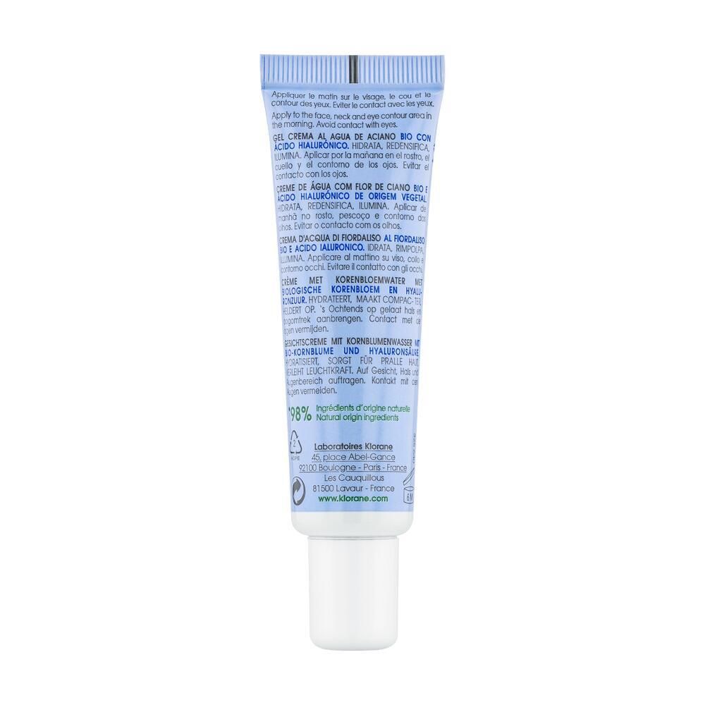 Dos du tube bleu clair. Texte en plusieurs langues. Contient des informations sur la Crème d'Eau de Bleuet.