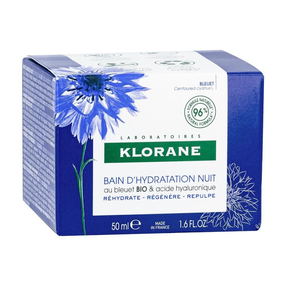 Blaue Schachtel mit Produkt. Aufschrift: Klorane, Bain d'Hydratation Nuit. Kornblume-Motiv. 96% natürliche Formel.