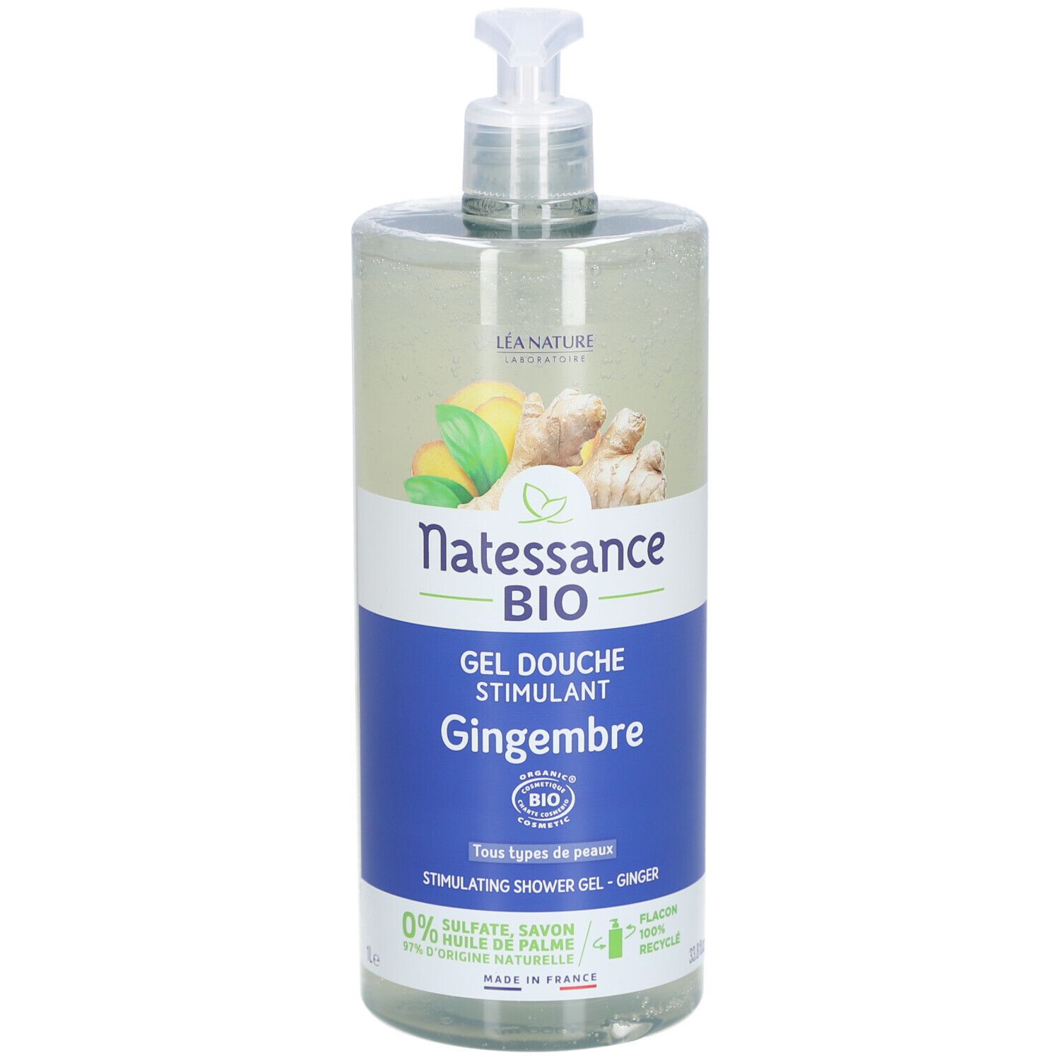 Flacon transparent avec pompe. Étiquette avec nom du produit, illustration de gingembre et label bio. Texte: Gel Douche Stimulant Gingembre.