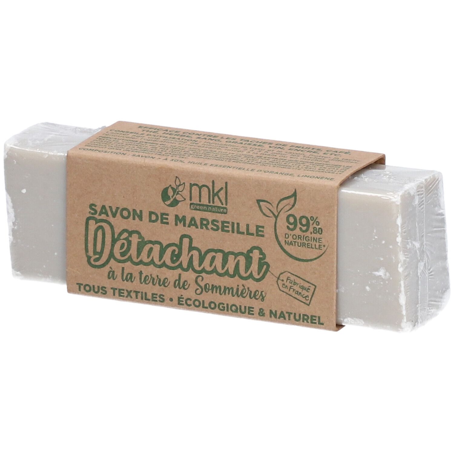 Pain de savon gris avec banderole en papier. Inscription: Savon de Marseille D
étachant, 99% d'origine naturelle.