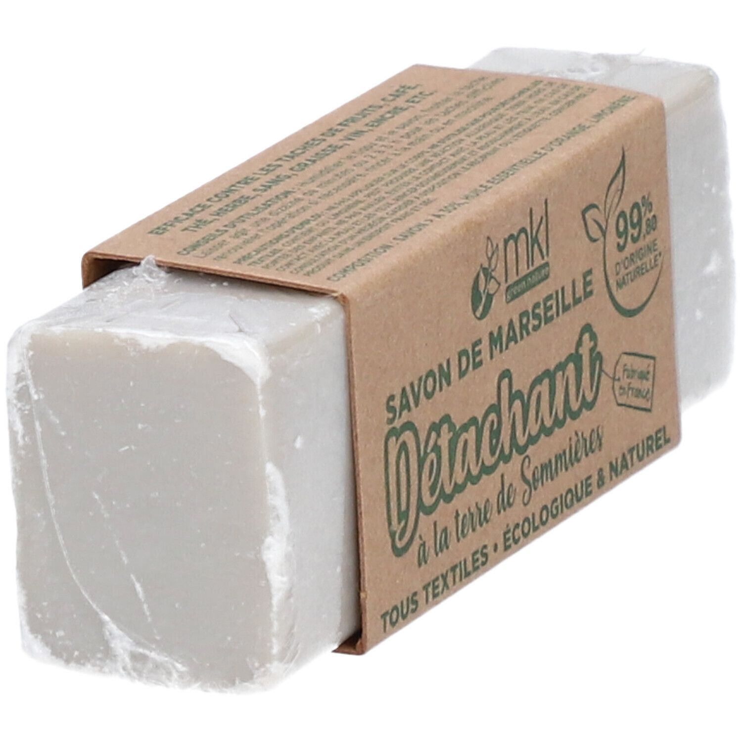Pain de savon gris avec banderole en papier. Inscription: Savon de Marseille D
étachant, 99% d'origine naturelle.