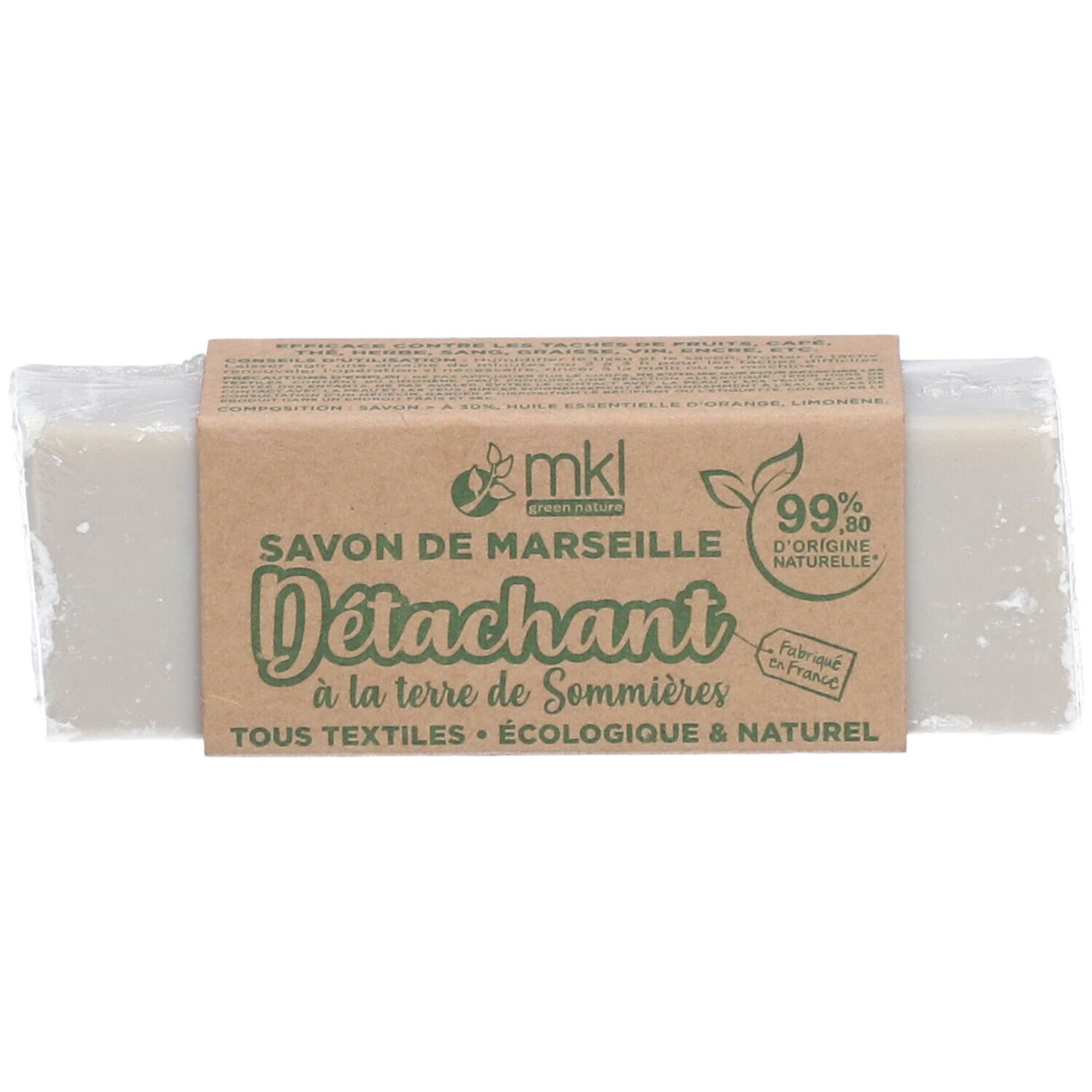 Pain de savon gris avec banderole en papier. Inscription: Savon de Marseille D
étachant, 99% d'origine naturelle.