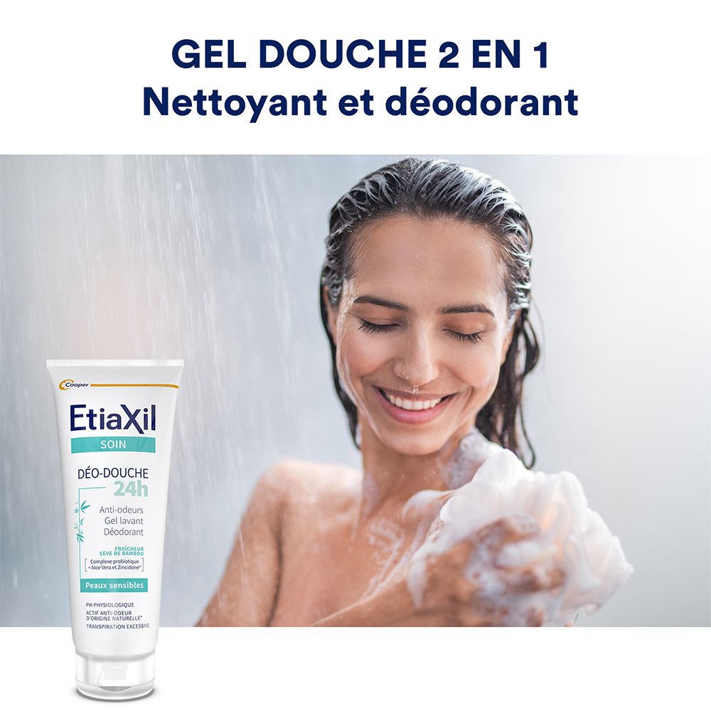 Femme sous la douche. Tube de gel douche Etiaxil au premier plan. Texte : 'Gel Douche 2 en 1'.
