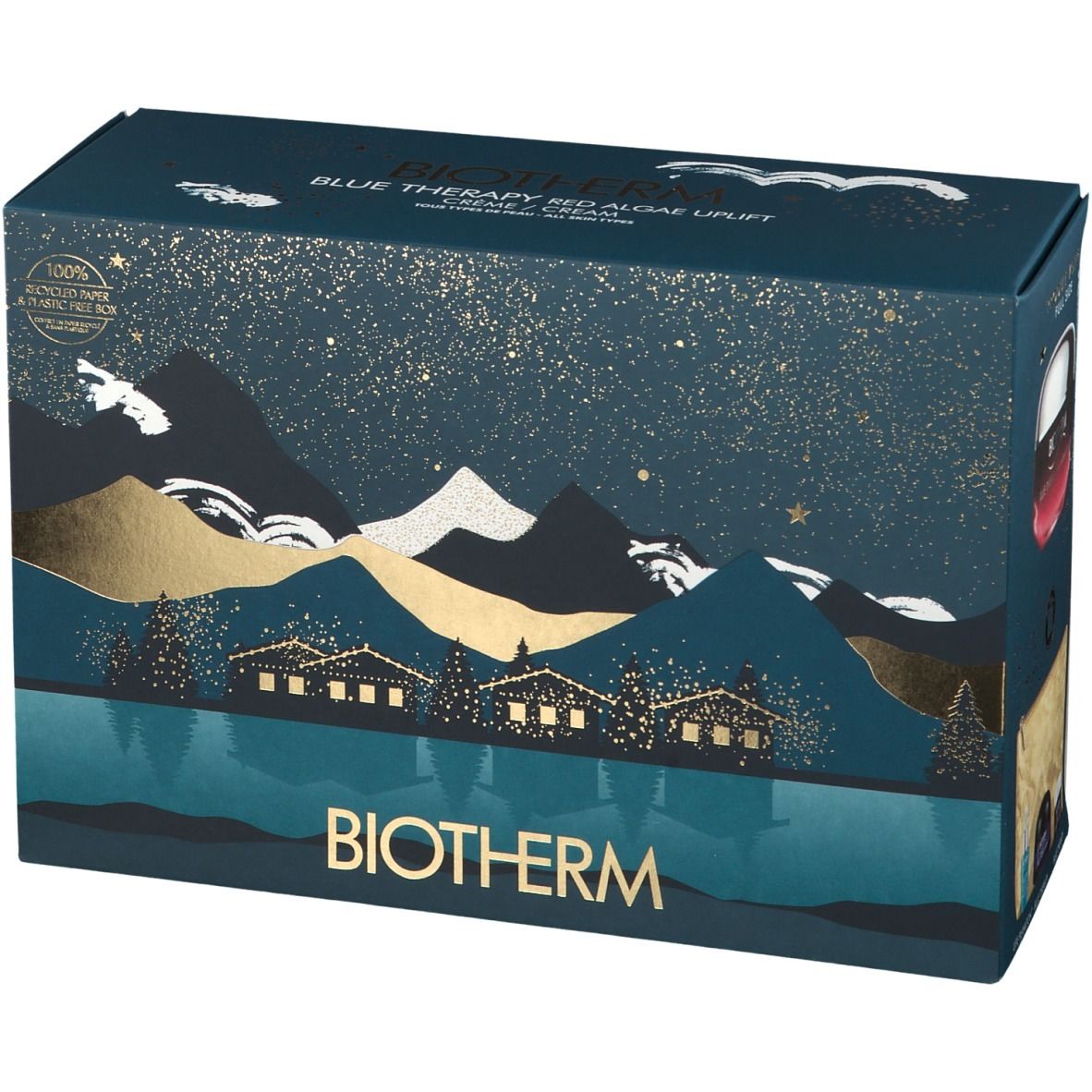 Dunkelblaue Geschenkbox mit Landschaftsmotiv und goldenen Akzenten. BIOTHERM-Logo unten. Text: BLUE THERAPY RED ALGAE UPLIFT.