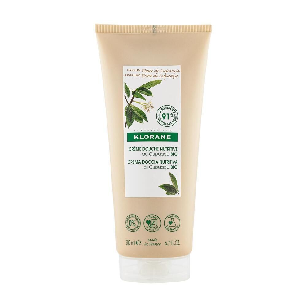 Beige Tube mit weißem Deckel. Aufschrift: Klorane, Crème Douche Nutritive au Cupuaçu BIO. Grün-weiße Etiketten.