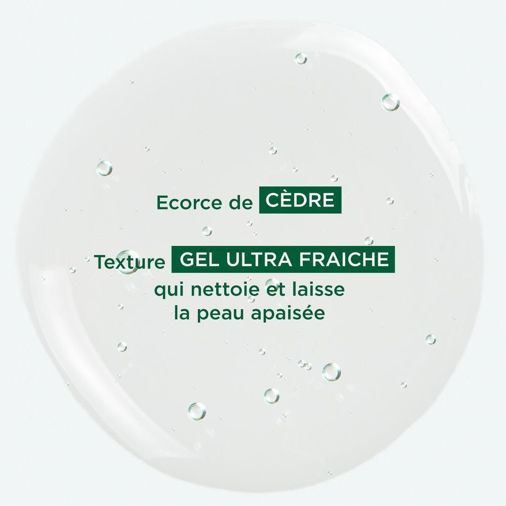 Liquide transparent avec texte : Ecorce de Cèdre, Texture GEL ULTRA FRAICHE. Inscription : qui nettoie et laisse la peau apaisée.