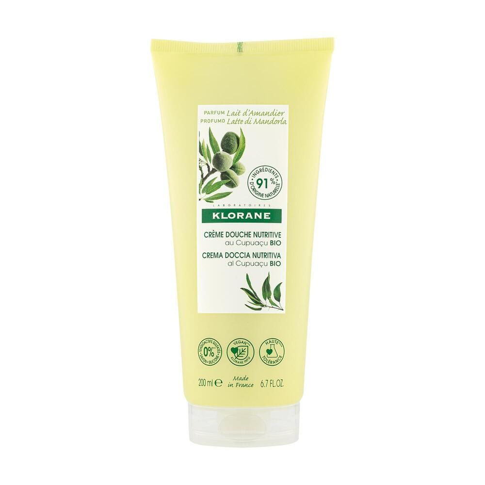 Tube jaune de crème de douche KLORANE au lait d'amande. Inscription : branche d'amande, 91% d'ingrédients d'origine naturelle, 200 ml.