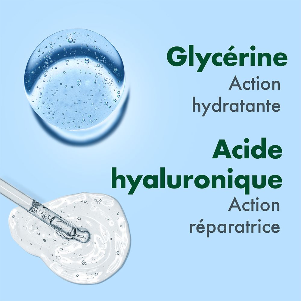 Gros plan sur des gouttes d'eau et des ingrédients. Texte: Glycérine, Acide hyaluronique. Fond bleu.