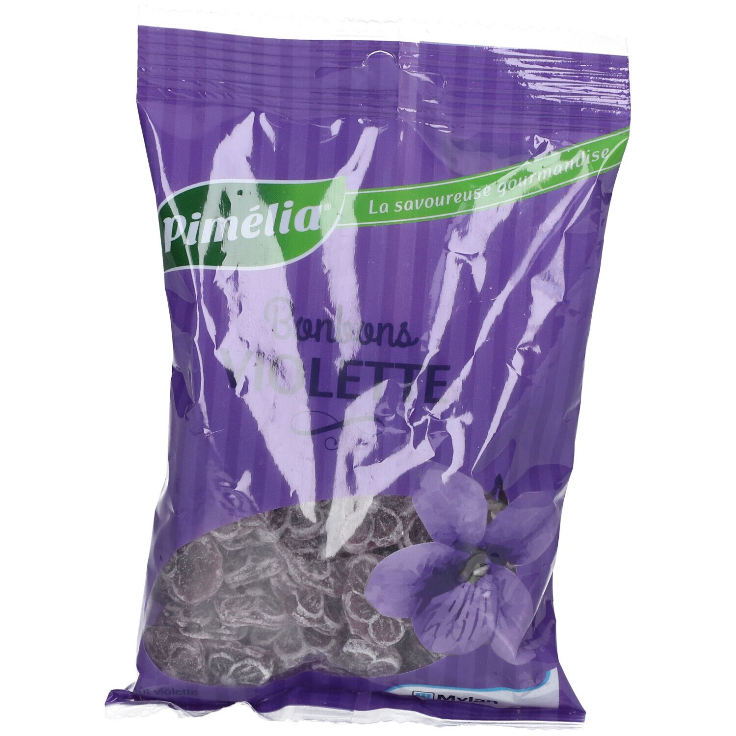 Violette Bonbons in lila Verpackung. Marke Pimélia. Sichtbare Bonbons und Veilchenblüte.
