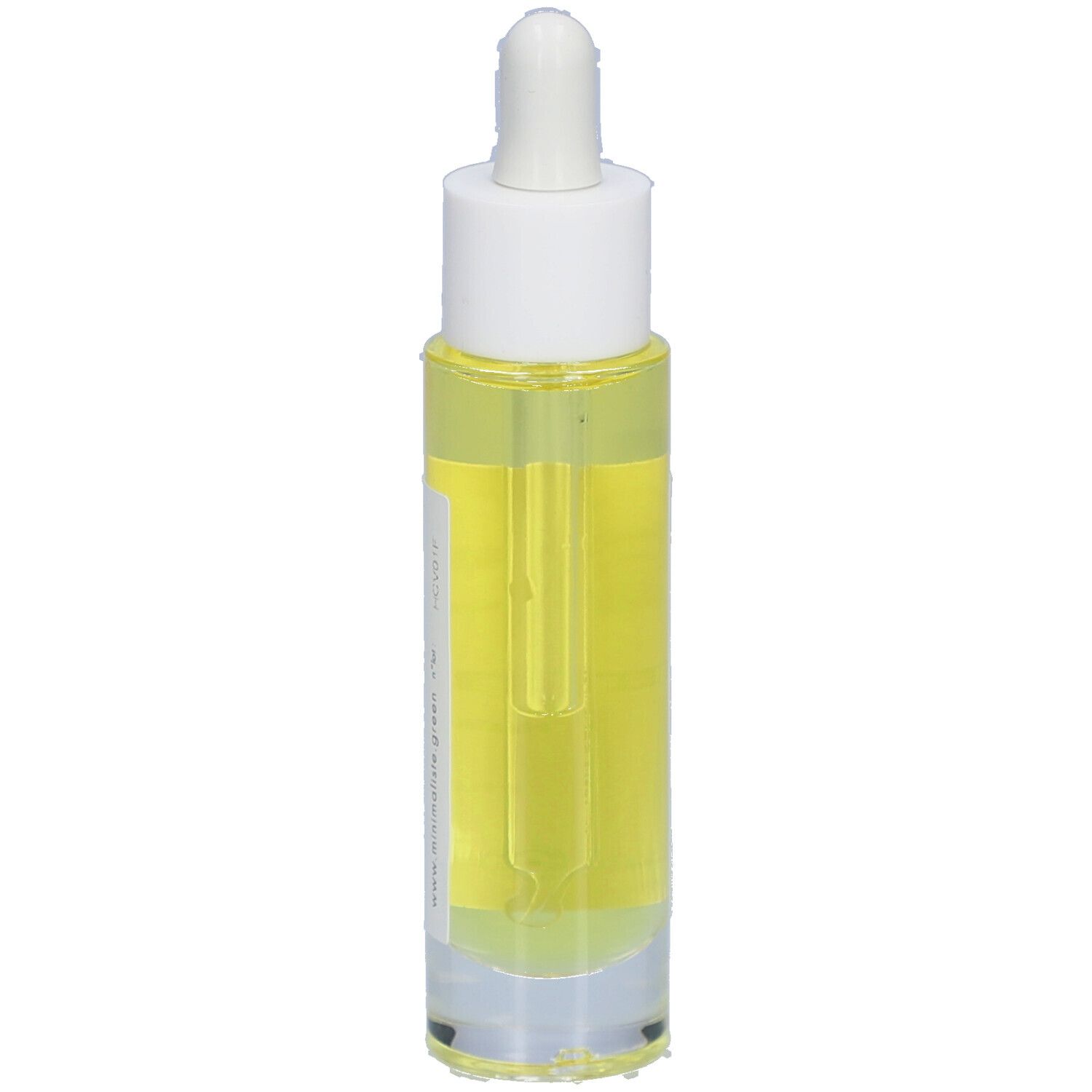 Flacon d'huile capillaire avec pipette. Étiquette avec nom du produit et certifications. Liquide jaune visible.