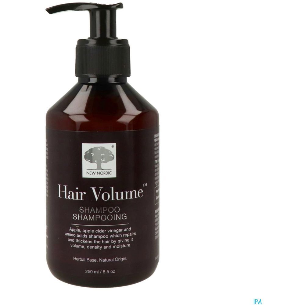 Bruine fles met zwarte pomp. Opschrift: Hair Volume Shampooing. Bevat appel, appelazijn en aminozuren. 250 ml.