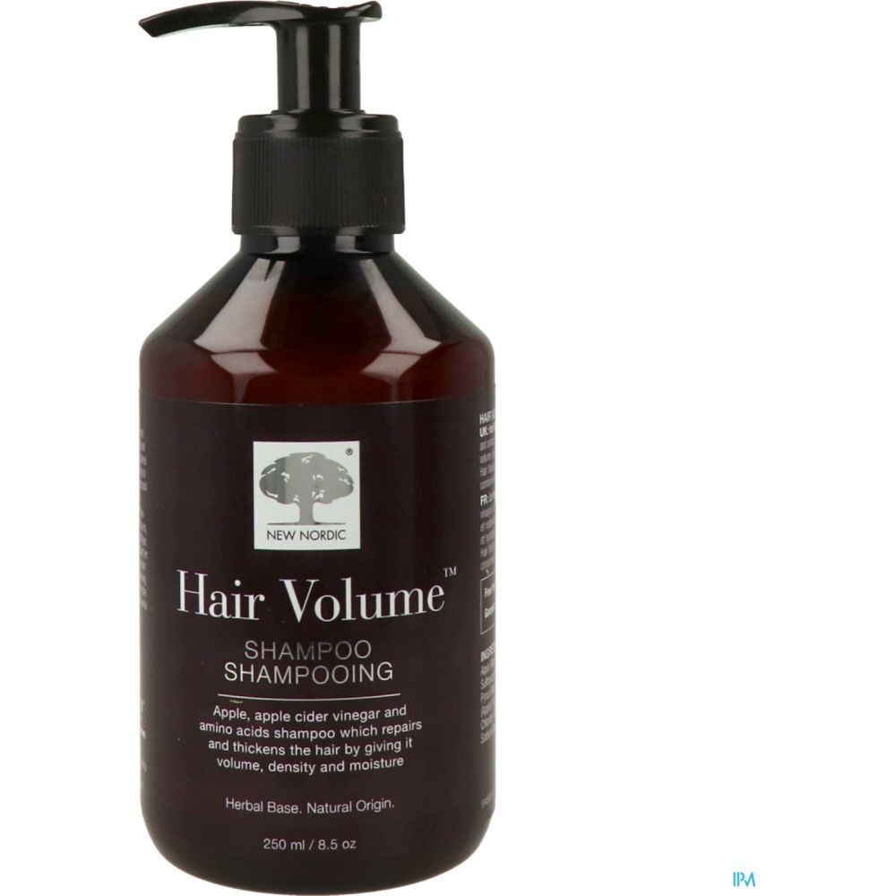 Bruine fles met zwarte pomp. Opschrift: Hair Volume Shampooing. Bevat appel, appelazijn en aminozuren. 250 ml.
