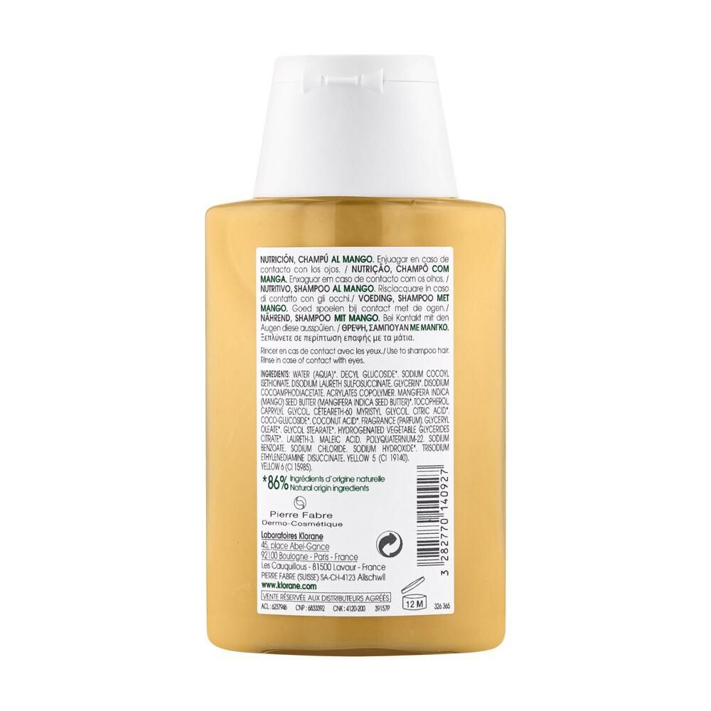 Rückseite einer gelben Shampoo-Flasche mit weißem Deckel. Text mit Inhaltsstoffen und Informationen. 86% natürliche Inhaltsstoffe.